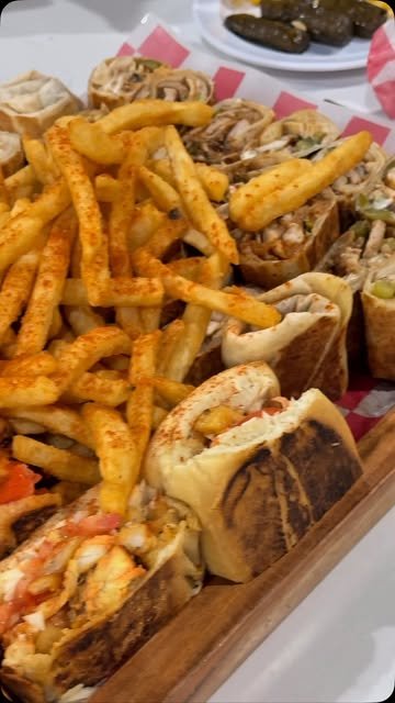 Fresh fries and a spread of dishes from KabobG’s restaurant