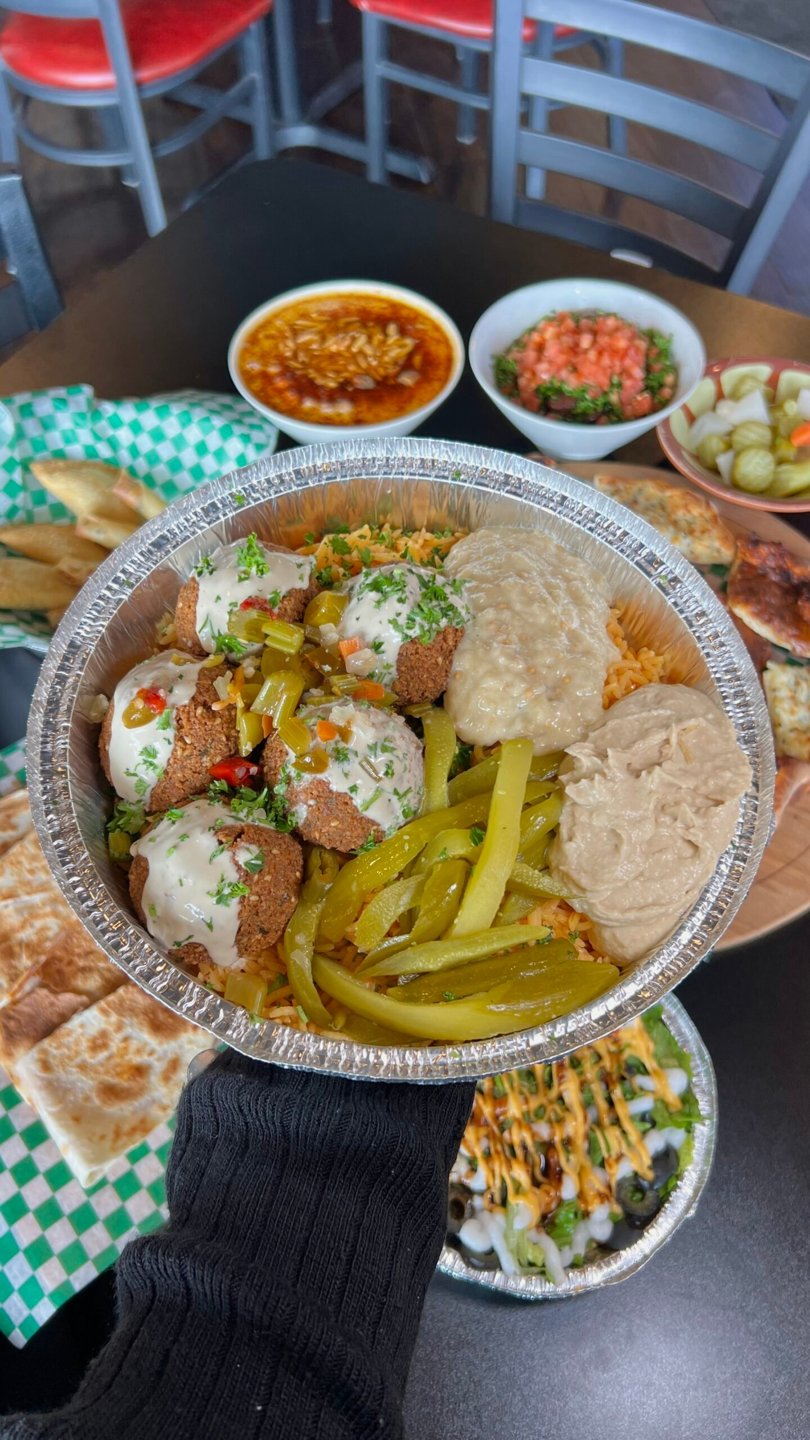 Kabob and falafel family tray with rice, salad and dips